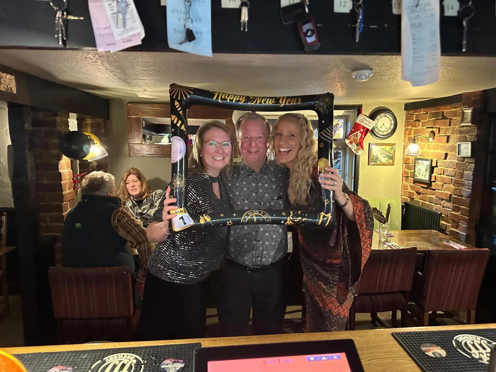 Three guests celebrating together in the dining room